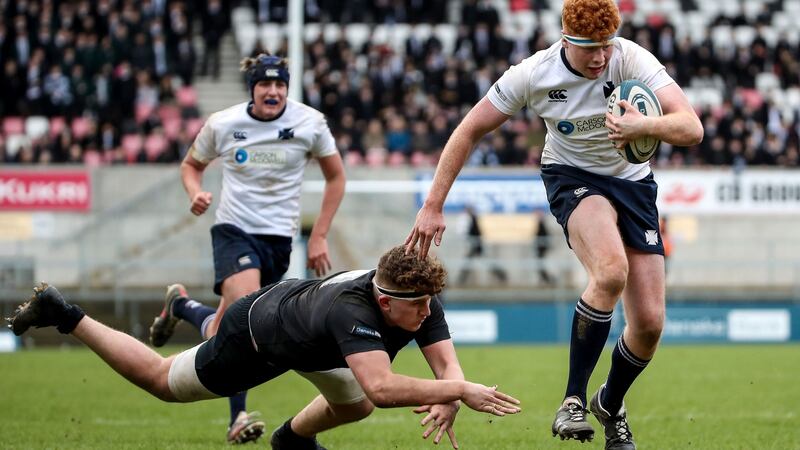 Methodist College’s Johnny O’Kane gets past the tackle of Flynn Longstaff of Campbell College during the Danske Bank Ulster Schools Senior Cup Final at Kingspan Stadium. Photograph: William Cherry/Inpho/Presseye