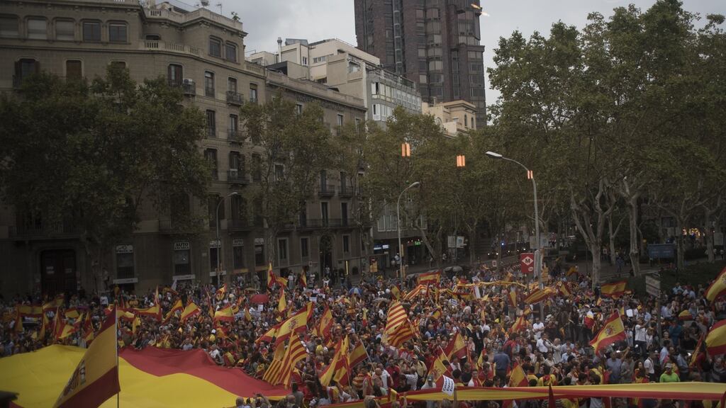 Anti-separatist demonstrators gather and wave Spanish flags during a rally against the Catalonian referendum at Placa Sant Jaume in Barcelona, Spain, on Saturday. Photograph: Geraldine Hope Ghelli/Bloomberg