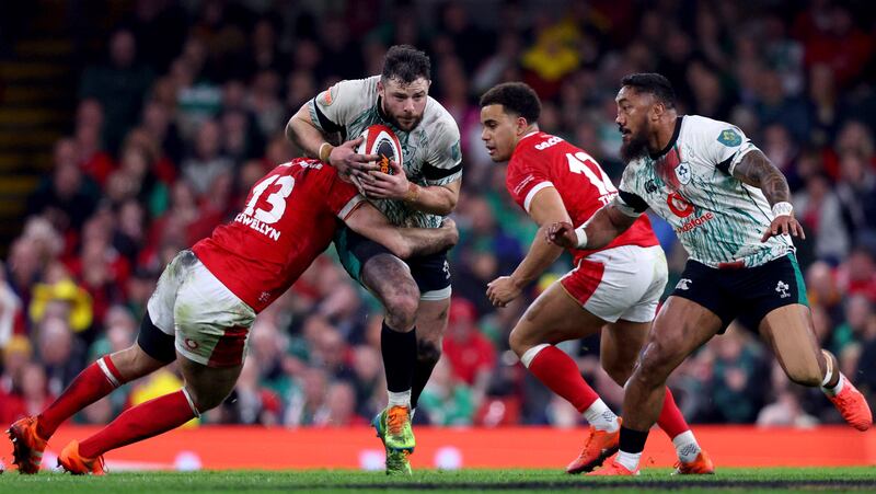 Robbie Henshaw tries to burst past Max Llewellyn and Ben Thomas during Ireland's win in Wales. Photograph: Ben Brady/Inpho