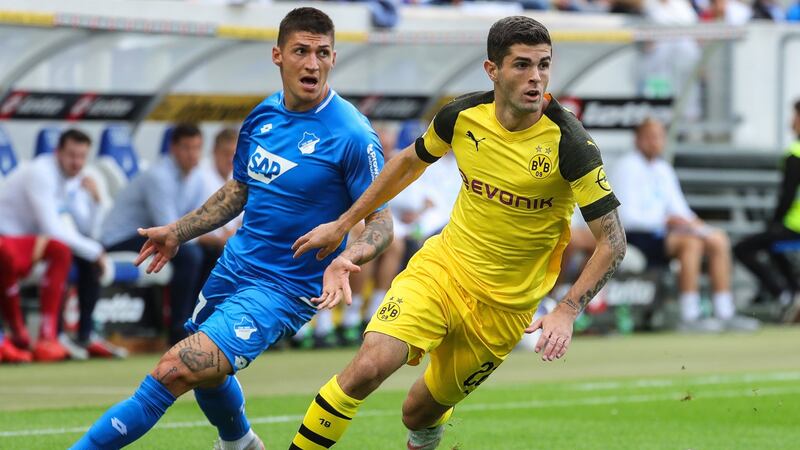 Christian Pulisic (right) in action for Borussia Dortmund against Hoffenheim’s Steven Zuber. The 20-year-old has signed to Chelsea for €64 million. Photograph: Armando Babani/EPA