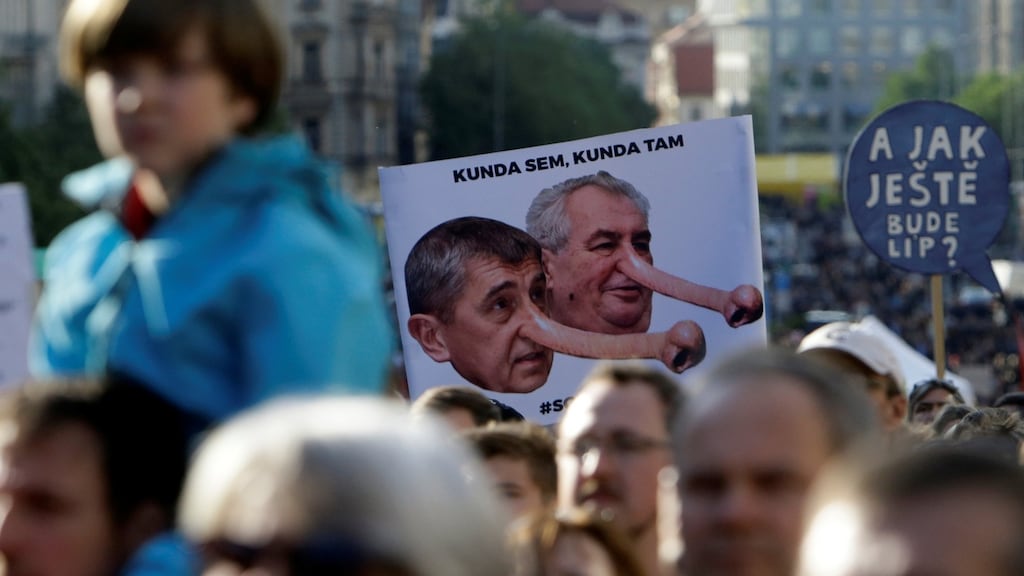 Demonstrators hold placards during a protest rally against Czech finance minister Andrej Babis and President Milos Zeman in Prague on Wednesday. Photograph: David W Cerny/Reuters