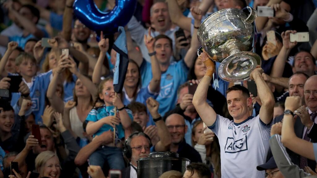 Dublin captain Stephen Cluxton lifts the Sam Maguire after leading his side to a fifth consecutive All-Ireland victory. Photograph: Oisín Keniry/Inpho
