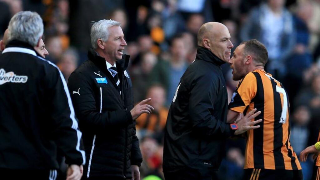 Fourth official Howard Webb restrains David Meyler after a clash with Alan Pardew. Photograph: Matthew Lewis/Getty Images
