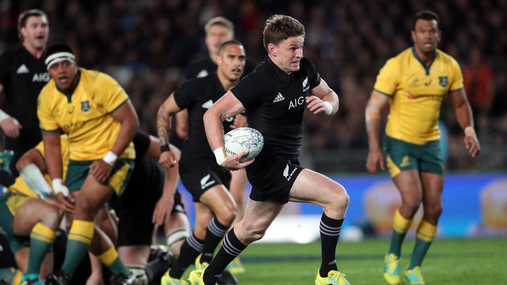 New Zealand outhalf Beauden Barrett runs away from the Australia defence ato score one of his four tries during the Rugby Championship match at Eden Park in Auckland . Photograph: Michael Bradley/AFP/Getty Images