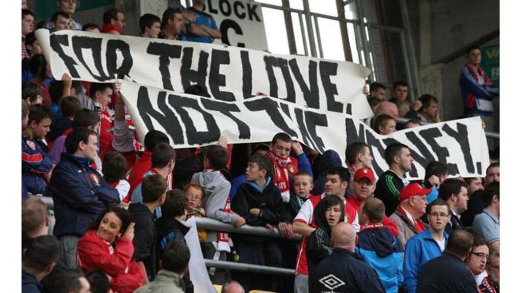 Some St Pat's supporters make their feelings known to the players prior to kick-off this evening. Photograph: Cathal Noonan/Inpho