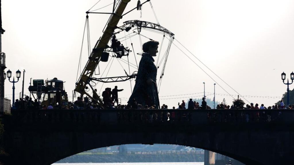 A cultural highlight: Tens of thousands people turned out to watch Royal de Luxe’s Grandmother crossing Sarsfield Bridge in Limerick. Photograph: Liam Burke/Press 22