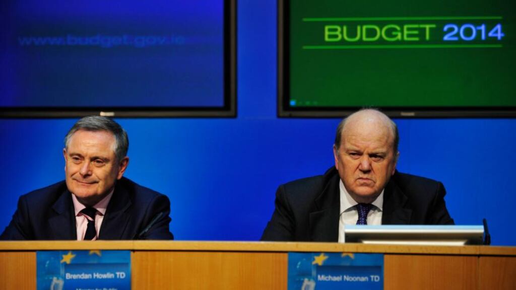 Minister for Finance Michael Noonan (right) and Minister for Public Expenditure and Reform Brendan Howlin at a post-budget press conference. photograph: aidan crawley