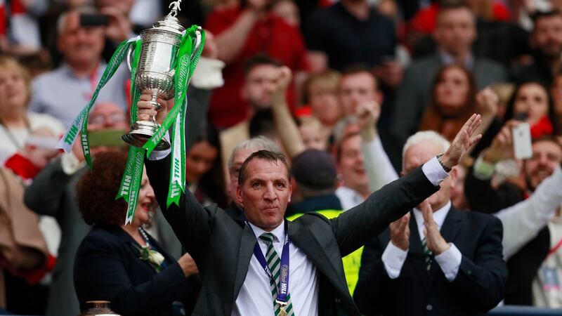 Celtic manager Brendan Rodgers lifts the trophy as he celebrates his side’s  Scottish Cup Final win over Aberdeen at Hampden Park. Photograph: Jason Cairnduff/Action Images via Reuters/Livepic