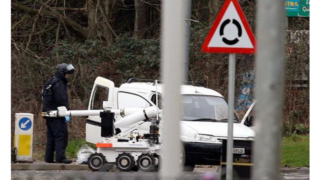 A bomb disposal expert inspects a van on the Letterkenny Road on the outskirts of Derry that was stopped by police this morning. Photograph: Paul Faith/PA Wire