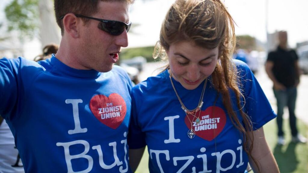 Supporters of the centre-left Zionist Union party wear T-shirts bearing the names of the party’s co-leaders, Isaac Herzog, also known by his nickname, Buji, and Tzipi Livni, during a campaign stop in the southern city of Ashdod on Friday. Photograph: Amir Cohen/Reuters