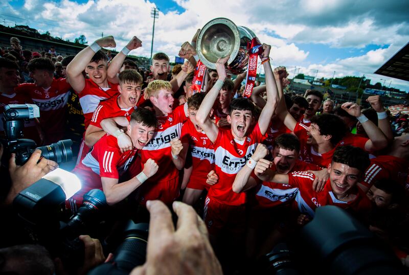 Derry celebrate with the Tom Markham Cup after victory over Monaghan. Photograph: Tom Maher/Inpho
