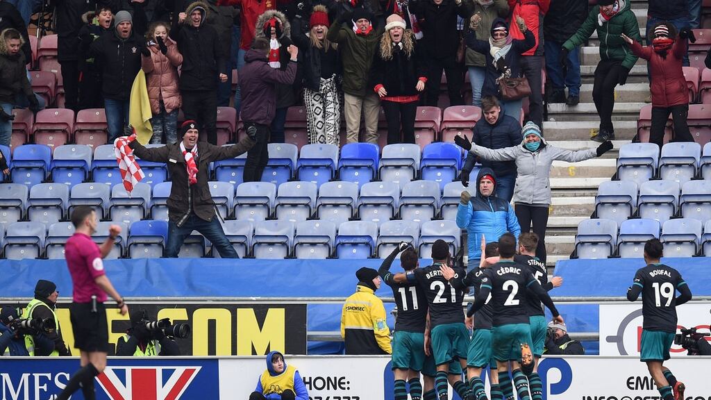 Southampton players celebrate with their fans after taking the lead during the FA Cup quarter-final win over Wigan. Photo: Oli Scarff/Getty Images