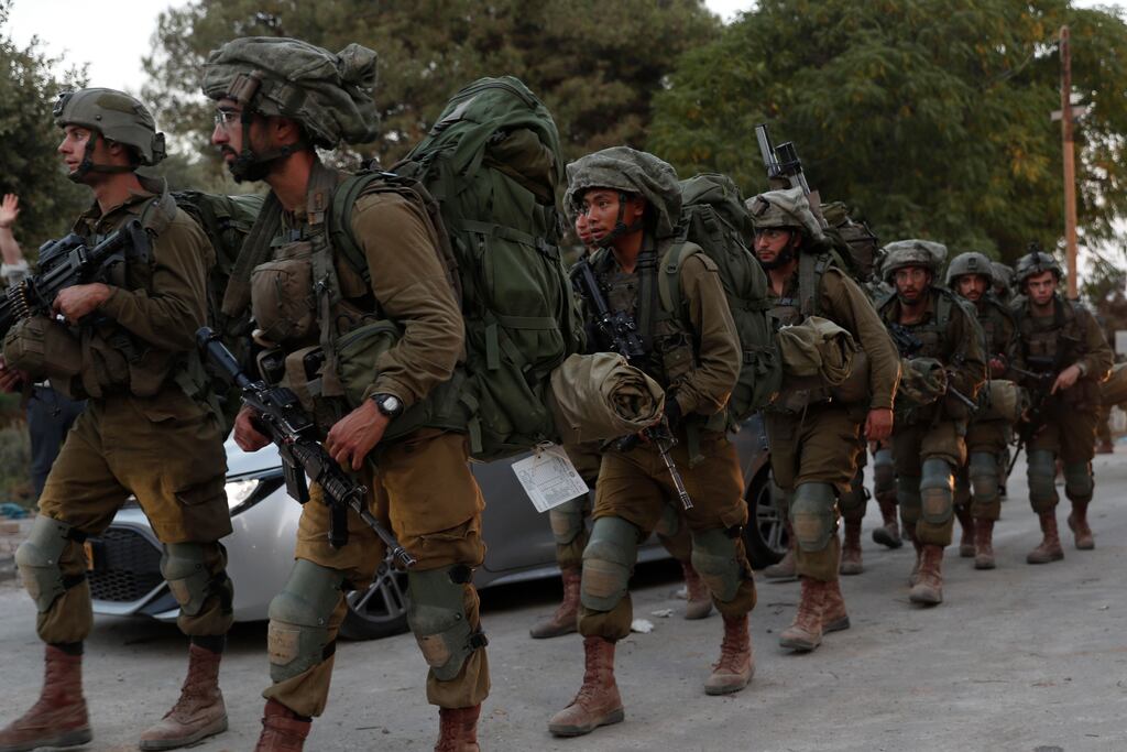 Israeli soldiers patrol the area of Be'eri, Israel. Up to 300,000 troops are massing to prepare for a ground offensive against Hamas within Gaza. Photograph: Atef Safadi/EPA