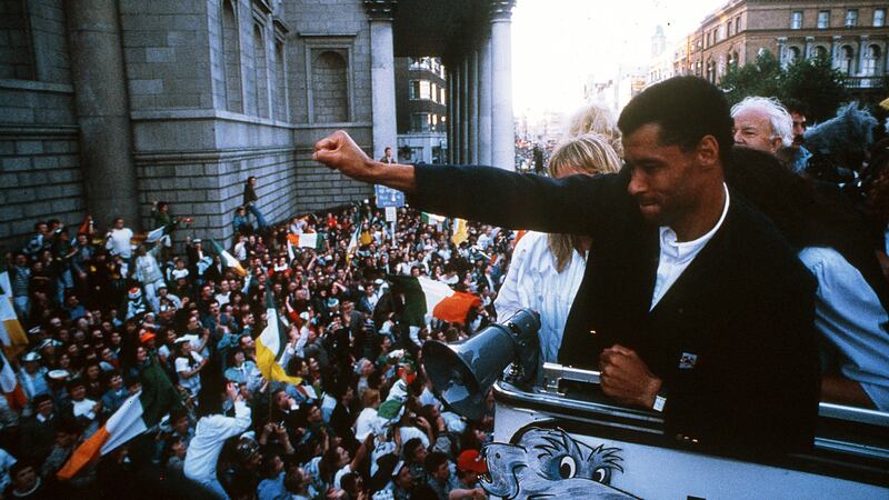 Paul McGrath waves to the crowds outside the GPO on O’Connell Street in Dublin after the Irish team returned from the 1990 World Cup in Italy. Photograph: Inpho