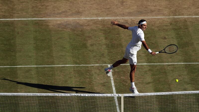 Federer makes a return at the net. Photo: Tim Ireland/PA
