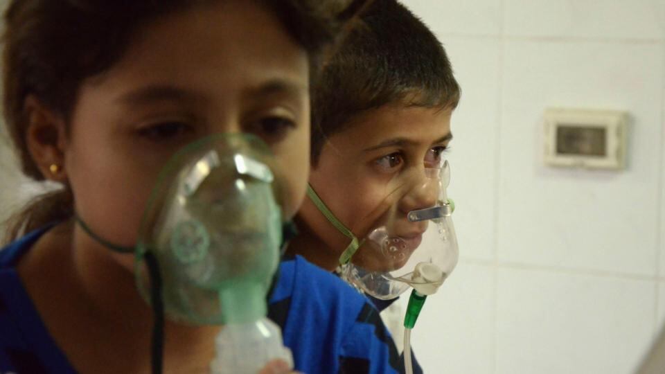 Children affected by what activists say was a gas attack breathe through oxygen masks in the Damascus suburb of Saqba. Photograph: Bassam Khabieh/Reuters