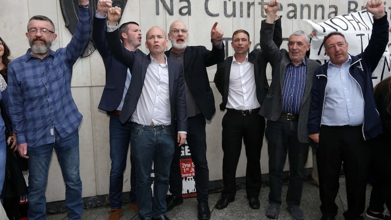 Defendants in the Jobstown trial, from left, Ken Purcell, Scott Masterson, Paul Murphy TD, Michael Murphy, Kieran Mahon, Frank Donaghy and Michael Banks leave the Dublin Circuit Criminal Court after they were all found not guilty. Photograph: Collins Courts