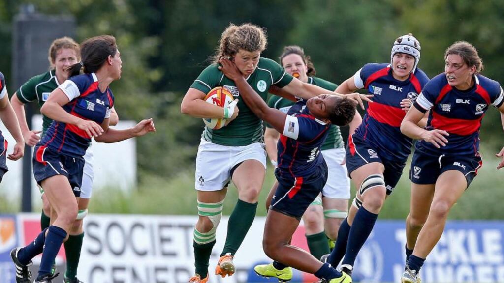 There’s no stopping Jenny Murphy as she hands off Akalaini “Bui” Baravilala of the USA during Ireland’s opening Pool B win. Photograph: Dan Sheridan/Inpho