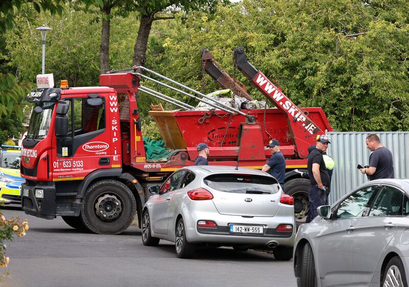 Gardaí remove a skip at a house in Clondalkin, west Dublin. Photograph: Colin Keegan/Collins Dublin