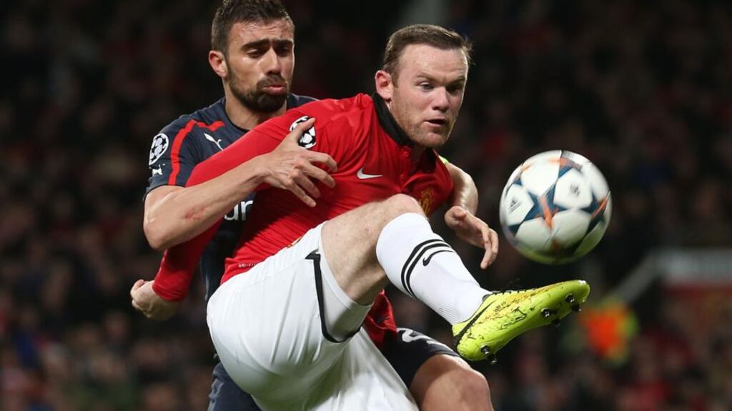 Wayne Rooney in action against Giannis Maniatis in Wednesday’ night’s 3-0 victory over Olympiakos. Photograph: Matthew Peters/Getty Images