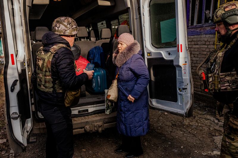 A woman is evacuated from her home after shelling nearby in Chasiv Yar, near Bakhmut, Ukraine, on Wednesday. Photograph: Daniel Berehulak/The New York Times