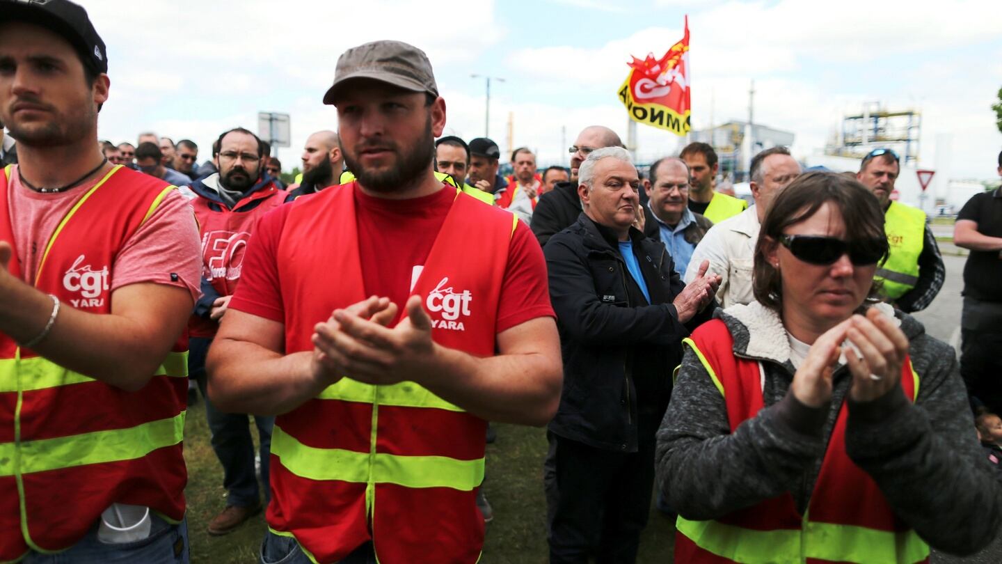 Members of the French trade union CGT applaud at the ExxonMobil oil refinery in Notre-Dame-de-Gravenchon, northwestern France, during blockades and strikes at several oil refineries and fuel depots in France by protesters opposed to government labour reforms. Photograph: Charly Triballeaucharly/AFP/Getty Images