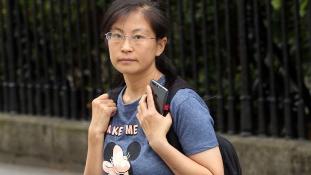 A file image of Cheng Zhang leaving the Four Courts after her earlier High Court case. Photograph: Collins Courts.