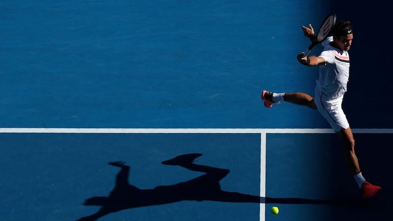 Roger Federer of Switzerland hits a shot against Marton Fucsovics of Hungary during their clash at the Australian Open. Photo: Edgar Su/Reuters