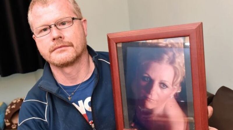 Richard Satchwell holding a photo of his missing wife Tina at their home in Youghal, Co Cork. Photograph: Irish Examiner