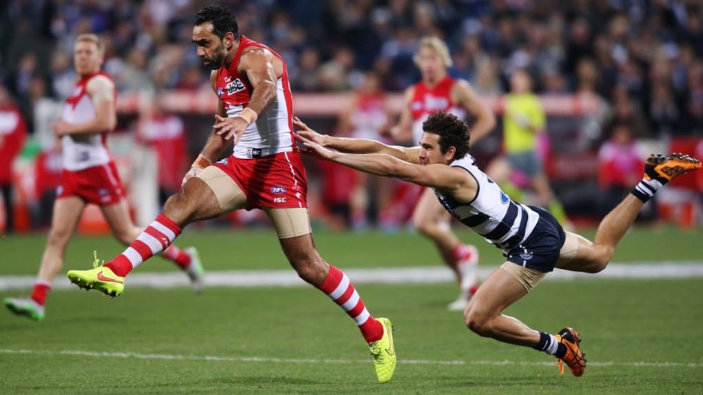 Adam Goodes of the Sydney Swans kicks the ball at goal during his return to AFL action in the game against Geelong Cats at Simonds Stadium in Geelong. Photograph: Michael Dodge/AFL Media/Getty Images