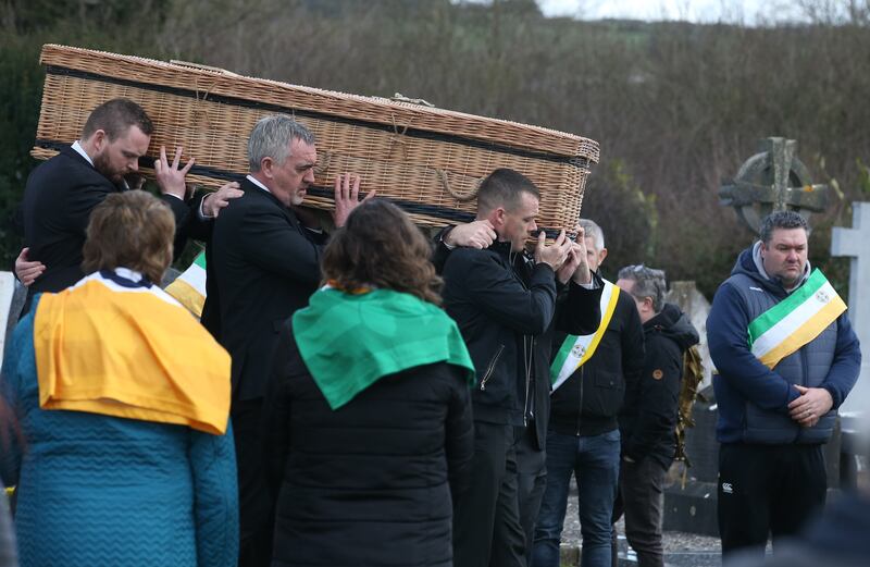 The coffin of Ann Delaney is carried into the graveyard at St Abban’s Church. Photograph: Stephen Collins/Collins