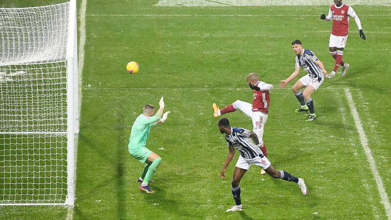 Alexandre Lacazette scores Arsenal’s fourth against West Brom. Photograph: Michael Regan/Getty