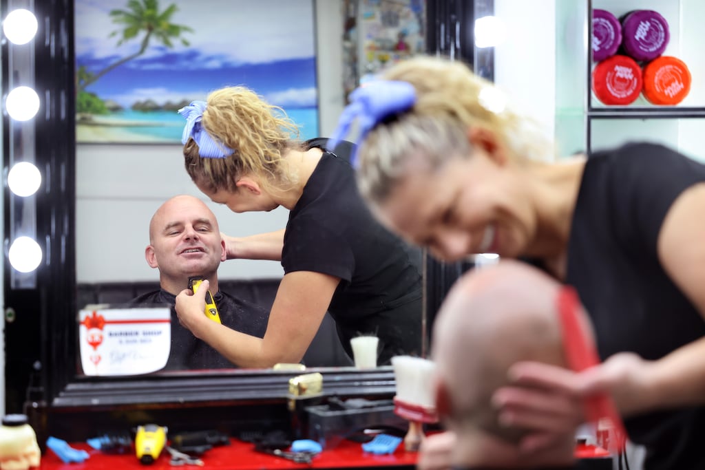 Niall Kane, a customer with Sylwia Karasinska, at SK Barber Shop, in Tullamore: 'I’ve heard a lot of people are still going to vote for Gavin, to spoil their vote.'
Photograph: Dara Mac Dónaill/ The Irish Times