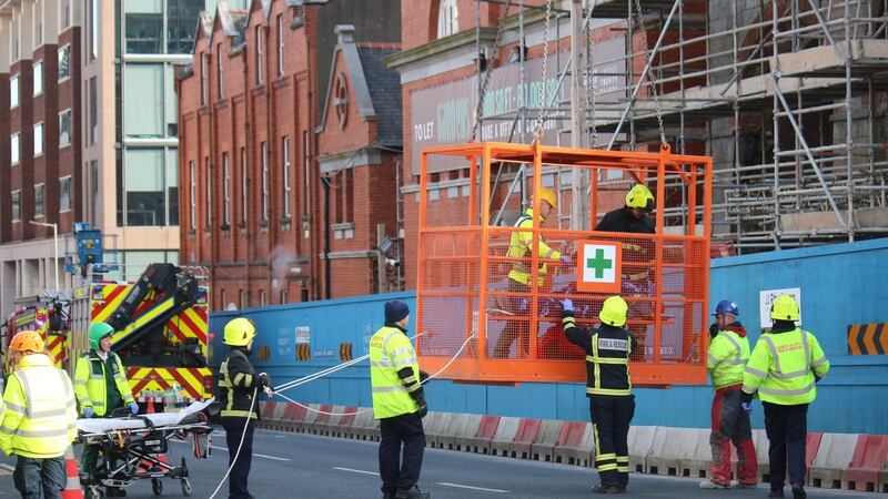 Emergency services get a  patient off a building in Henry Street, Limerick. Photograph: Brendan Gleeson