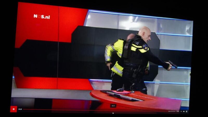 Police arrest the gunman in a studio´: they could be heard shouting: “Drop it! Drop It! Get on your knees!” The youth replies: “I’ve dropped it! It’s dropped!” He was then handcuffed and taken away for questioning. Photograph: AFP Photo/ANP/NOS