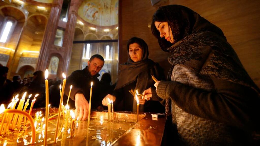 Armenian people light candles as they attend a commemoration ceremony for Armenians who lost their lives during mass killings under the Ottoman empire, at the Armenian Apostolic Church in Moscow. Armenians commemorated the 100th anniversary of the Armenian massacres on April 24th. Photograph: Yuri Kochetkov