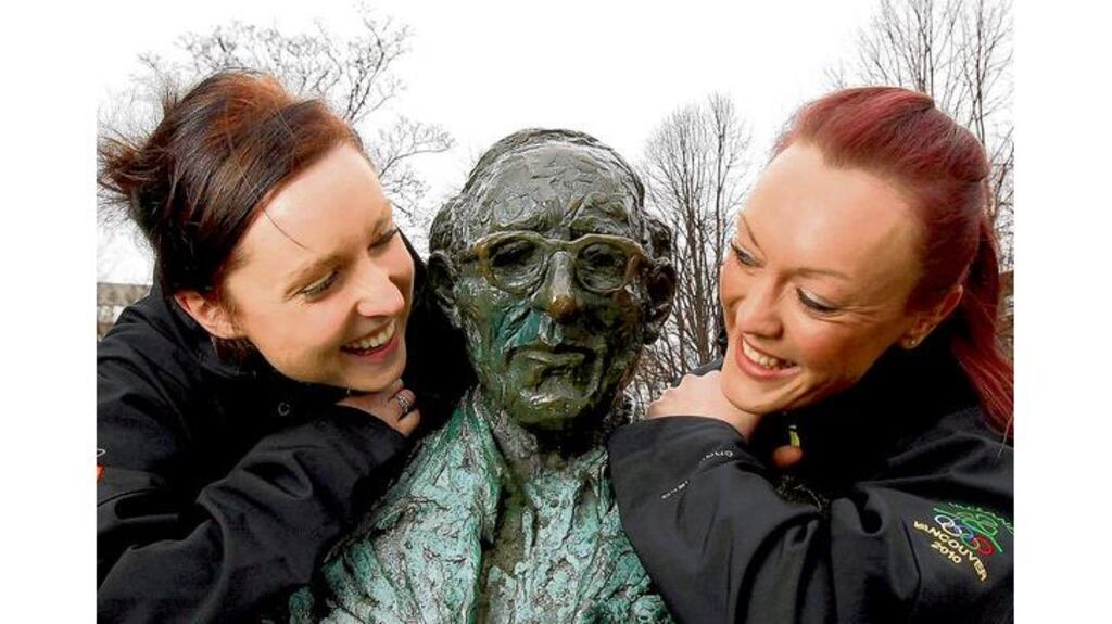 Bobsleigh pair Claire Bergin, brakewoman, and Aoife Hoey, pilot, with the statue of Patrick Kavanagh beside the Grand Canal at the announcement of the Irish line-up for the Winter Olympics in Vancouver.