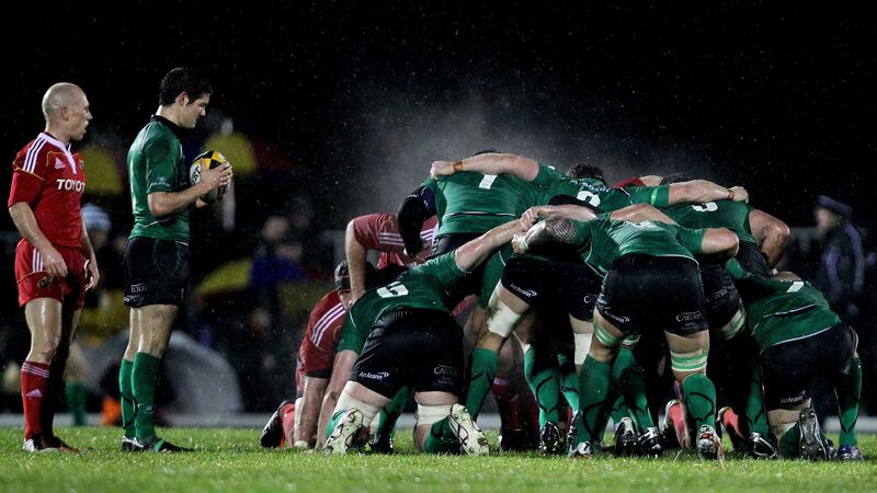In action for Connacht against Munster and Peter Stringer in 2010. Photograph: James Crombie/Inpho
