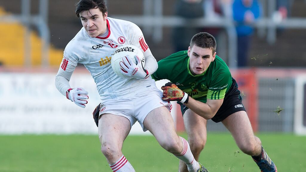 Tyrone’s Lee Brennan in action against Queen’s University’s Greg McCabe. Brennan is one of the coming men on Mickey Harte’s side. Photograph: Trevor Lucy/Inpho/Presseye