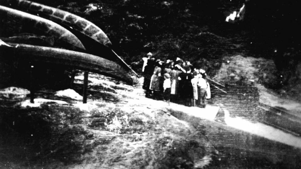 Islanders gather around the King on the slipway at Caladh an Oileáin as he distributes the mail. Photo by George Thomson. Taken from The Last Blasket King by Gerald Hayes with Eliza Kane (The Collins Press)