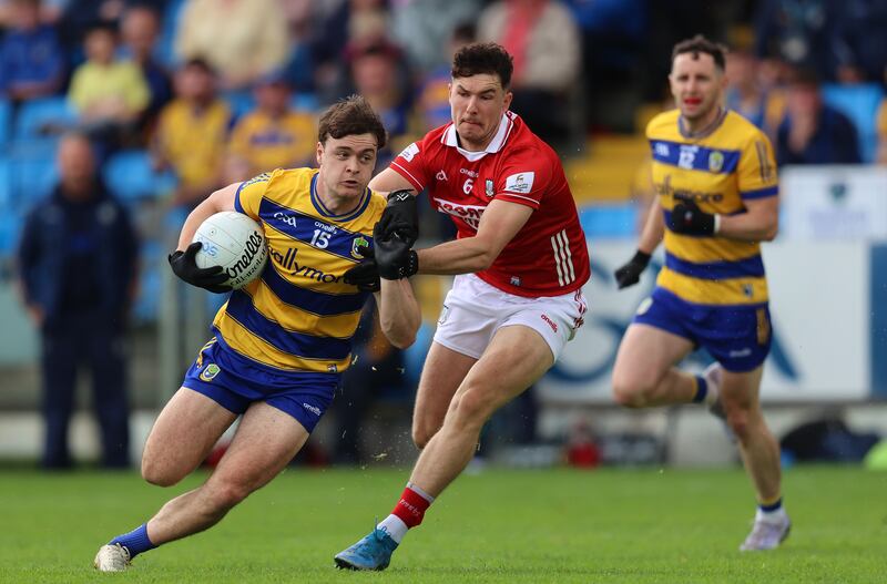 Cork’s Seán Brady tackles Ben O’Carroll of Roscommon during the game in Portlaoise. Photograph: Leah Scholes/Inpho