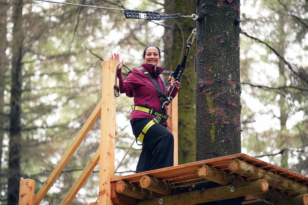 Minister for Sport Catherine Martin braves the altitude at the opening of Zip Trail, a brand new zip line course based at Coillte's Tibradden Wood, in the Dublin Mountains on Monday. Photograph: Niall Carson/PA