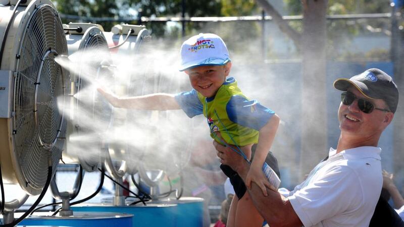 Fans cool off during a heat wave on day two of the Australian Open. Photograph: Joe Castro/EPA