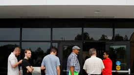 US companies add more new jobs than expected and raise wages