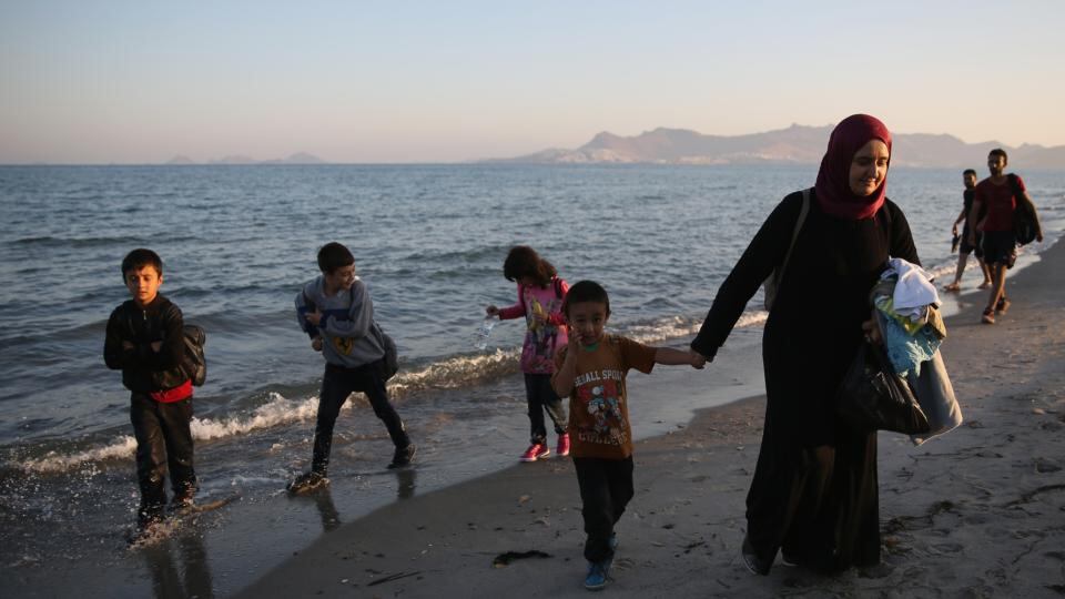 Migrant families from Syria arrive on the beach at sunrise on the island of Kos after crossing a three mile stretch of the Aegean Sea from Turkey on Friday. Photograph: Getty