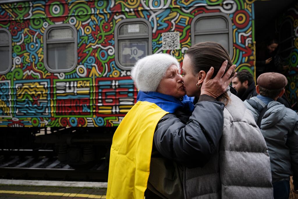 Oksana Shevluga kisses her daughter, Anastasia, as they reunite after nearly five months. Photograph: Lynsey Addario/The New York Times