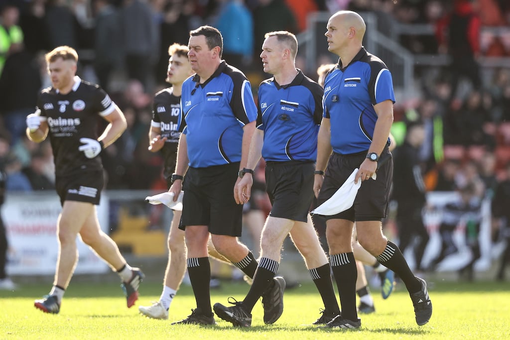 Brian Higgins with his sideline officials at half-time during the Down SFC final between Kilcoo and Burren at Páirc Esler, Newry. Photograph: Ben Brady/Inpho
