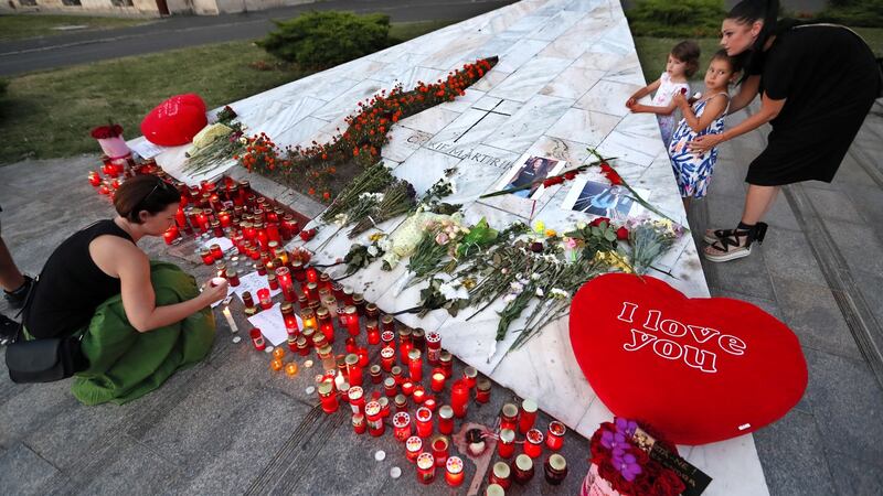 People light candles prior to a protest in front of the interior ministry headquarters in Bucharest against the way Romanian authorities handled the kidnapping. Photograph: Robert Ghement/EPA