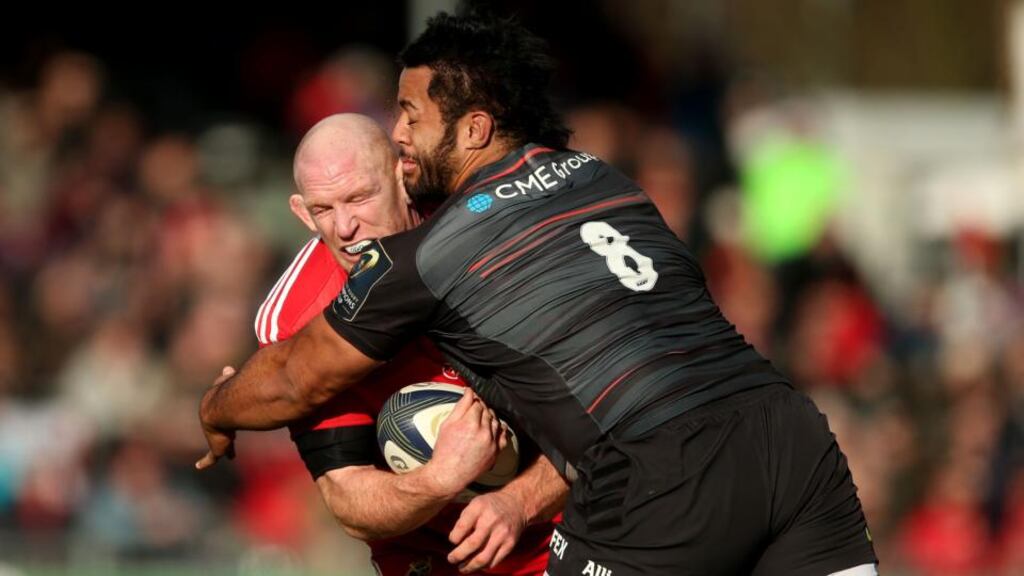 Munster’s Paul O’Connell is hit hard by Saracens number eight Billy Vunipola at Allianz Park. Photograph: James Crombie / Inpho