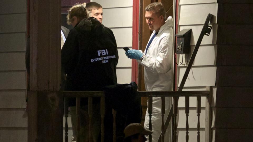 FBI agents search the home where three Cleveland women were found alive after vanishing in Cleveland, Ohio. The three women reunited with their families yesterday. Photograph: John Gress/Reuters